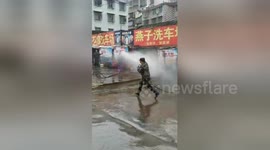 Car wash wars: Rival bosses spray hoses at each other in clash over customers in China's Hunan