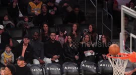 Katie Holmes and daughter Suri Cruise at the Los Angeles Lakers Vs The Detriot Pistons Basketball Game at The Staples Center in Los Angeles, Ca