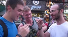 Tourists munch on scorpions on Bangkok's Khao San Road