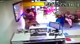 Have-a-go hero tackles armed robbers at post office