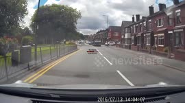 girl driver  just pulls out onto major road without a care for oncoming vehicles