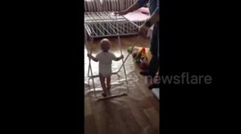 Learning to walk with assistance of metal clothes dryer...
