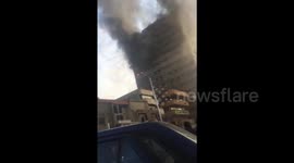 Many feared dead as high-rise building on fire in Tehran collapses