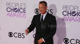 Tom Hanks jokes with photographers on the red carpet of The 2017 Peoples' Choice Awards