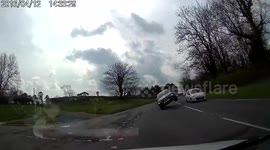 Motorist narrowly escapes hitting car on two wheels