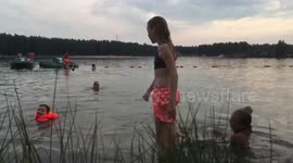 Girl jumping in water slow-mo