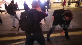 Anti Trump protestors fight with Trump supporter in London