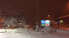 Snow plows at work while snow falls in Flagstaff, Arizona.