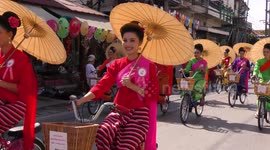 Borsang Umbrella Beauties riding bicycles
