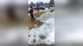 Newsflare Edit - Student dives into freezing puddle to win bet