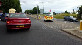 Cop Car drives into oncoming traffic
