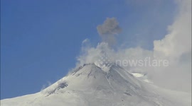 Snow-covered volcano starts steaming