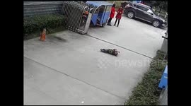 People lift up car to rescue boy trapped under it