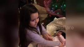 Newsflare Edit - Big sister starts to cry because she loves her baby sister