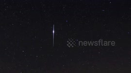 Bright Iridium flare in the night sky