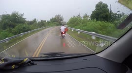Riding with naked turkey on scooter