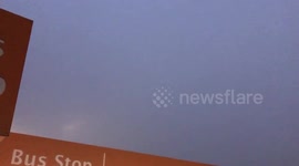 Plane almost rendered invisible by freezing fog at Heathrow Airport