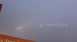 Newsflare Edit - Plane almost rendered invisible by freezing fog at Heathrow Airport