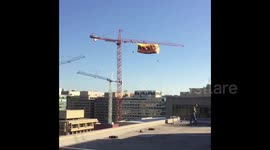 Newsflare Edit - Activists unfurl anti-Donald Trump RESIST banner from crane in Washington DC