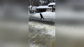 Five-year-old practices ice skating on frozen road in Wisconsin