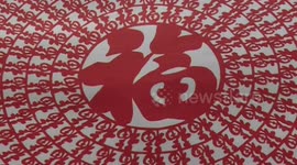 Man cuts 365 Chinese characters out of one piece of paper to give message of 'blessing'