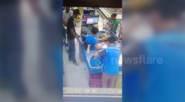 Bungling robber pulls knife on checkout girl inches from off-duty cop