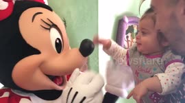 Girl, 1, astonished when she meets her 'hero' Minnie Mouse