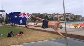 Man channels 'beast mode' to become a human flag for Australia Day