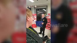 Shop security guard spontaneously bursts into a duet with a customer
