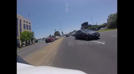 Motorbike sent onto opposite traffic lane after collision with car