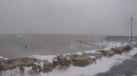 Surfer braves freezing temperatures on Lake Eerie