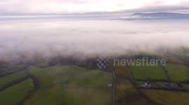 Stunning drone footage of fog over mountain in Northern Ireland