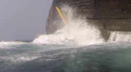 Kayaker slammed against cliff face