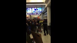 Protesters cheer as man appears to be released from detention at O'Hare airport