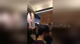 Newsflare Edit - Protesters cheer as man appears to be released from detention at O'Hare airport
