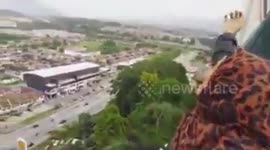 Daredevil girls defy death by climbing 200ft to top of sign