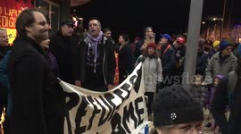 Aberystwyth, Ceredigion, West Wales, UK, 30th January 2017: Crowds of people turn out in fowl weather to show their solidarity against President Trumps so called Muslim Ban.