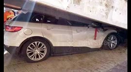 New car gets stuck under footbridge because newbie driver presses accelerator by mistake