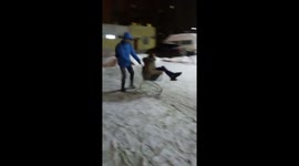 Riding in the grocery cart on a snowy street
