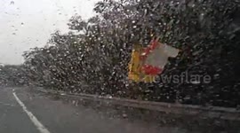 Car crashes into anti-collision buckets after avoiding another car suddenly changing lane