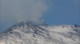 Mount Etna eruption from the snowy summit