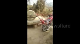 Creative woman mechanises ancient stone mill with motorcycle