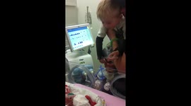 Big brother finally meets his premature sister