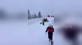 Newsflare Edit - Dad and lad snowboarding fail slow-mo