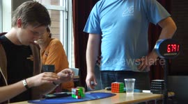 Man drops Rubik's Cube but still solves it in under 8 seconds