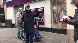 Man alleges that supposed charity worker is a 'con man' during angry street argument