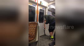 Newsflare Edit - CRAZY LAUGHING MAN ON TRAIN IN LONDON