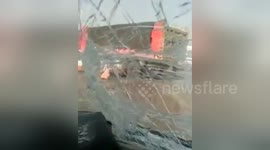 Car rear-ends runaway lorry stopped by police cars