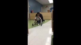 Baby with Down syndrome learns to walks with a walker