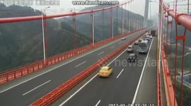 Driver stops car on bridge to take pictures causing accident